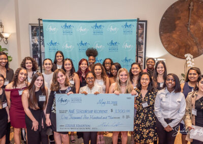 Group young ladies smiling with their awarded scholarship certificates from 2022