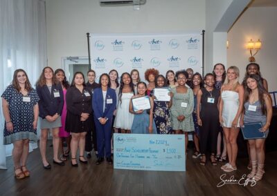 Group young ladies smiling with their awarded scholarship certificates from 2024